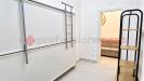 Appartamento bilocale in affitto a Portici - 10, Angolo moderno con scaffali e porta aperta.png