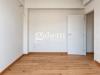 Appartamento bilocale in vendita ristrutturato a Firenze - 09, Interno minimalista con porta aperta.png