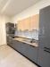 Appartamento in vendita ristrutturato a Modena - 03, Cucina moderna grigio e legno.png