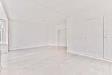 Appartamento in vendita a Arese in piazza cinque giornate - 06, spacious-empty-room.jpg