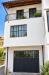 Appartamento bilocale in vendita da ristrutturare a Agli� - 02, Facciata mediterranea con balcone fiorito.png