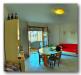 Appartamento bilocale in vendita con terrazzo a Porto Azzurro - 02, soggiorno con terrazza e angolo cottura